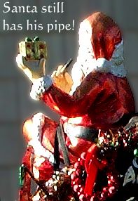 close up of Santa Clause and his PIPE on the roof of the liberty van