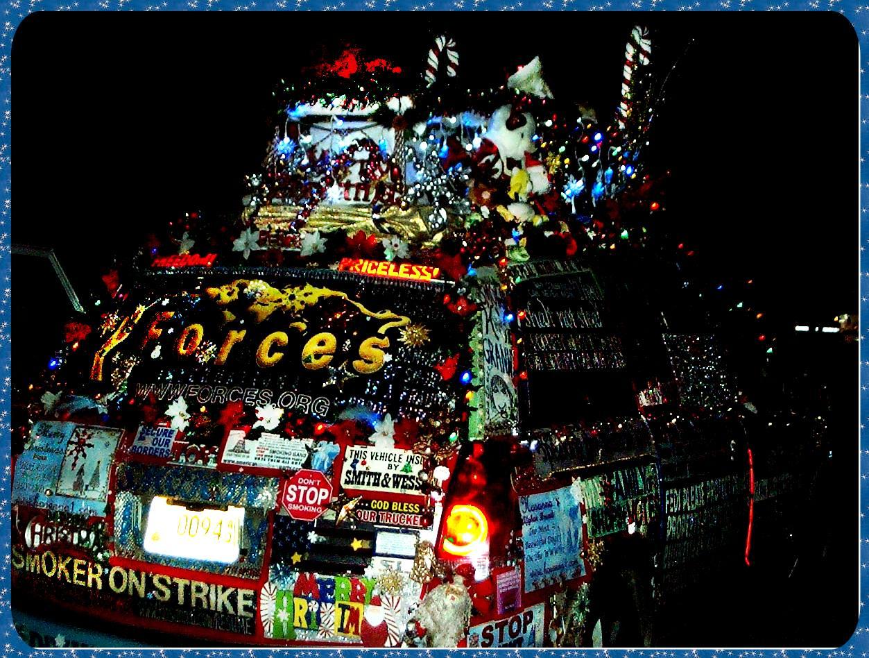 Rear view photograph of Liberty Van smokers rights van at Cave City, Kentucky Christmas parade, decorated and lighted vehicle
